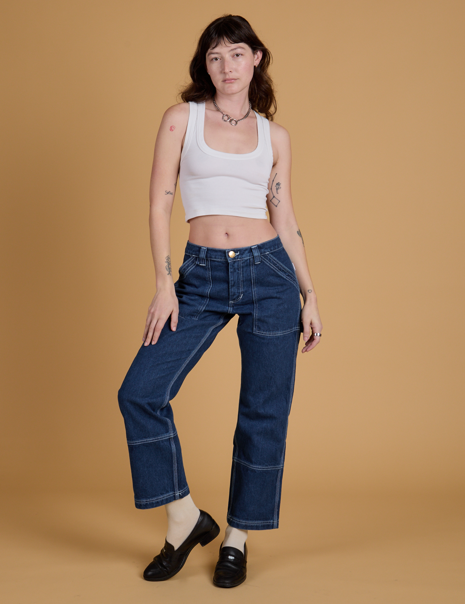 Mid-Rise Carpenter Jeans in Dark Wash and Cropped Tank in Vintage Tee White worn by Alex