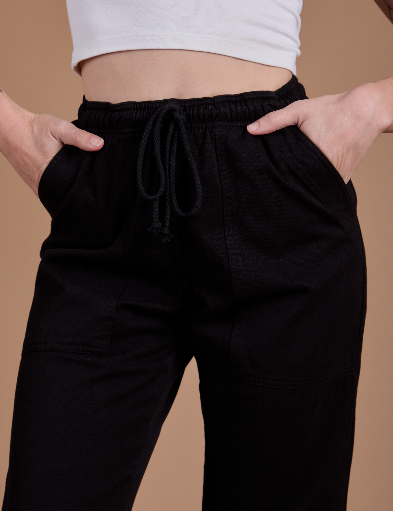 Organic Action Pants in Basic Black front close up on Alex
