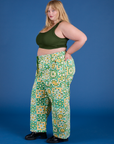 Side view of Drop Pocket Cargo Pants in Spring Quilt Print paired with evergreen Mini Tank