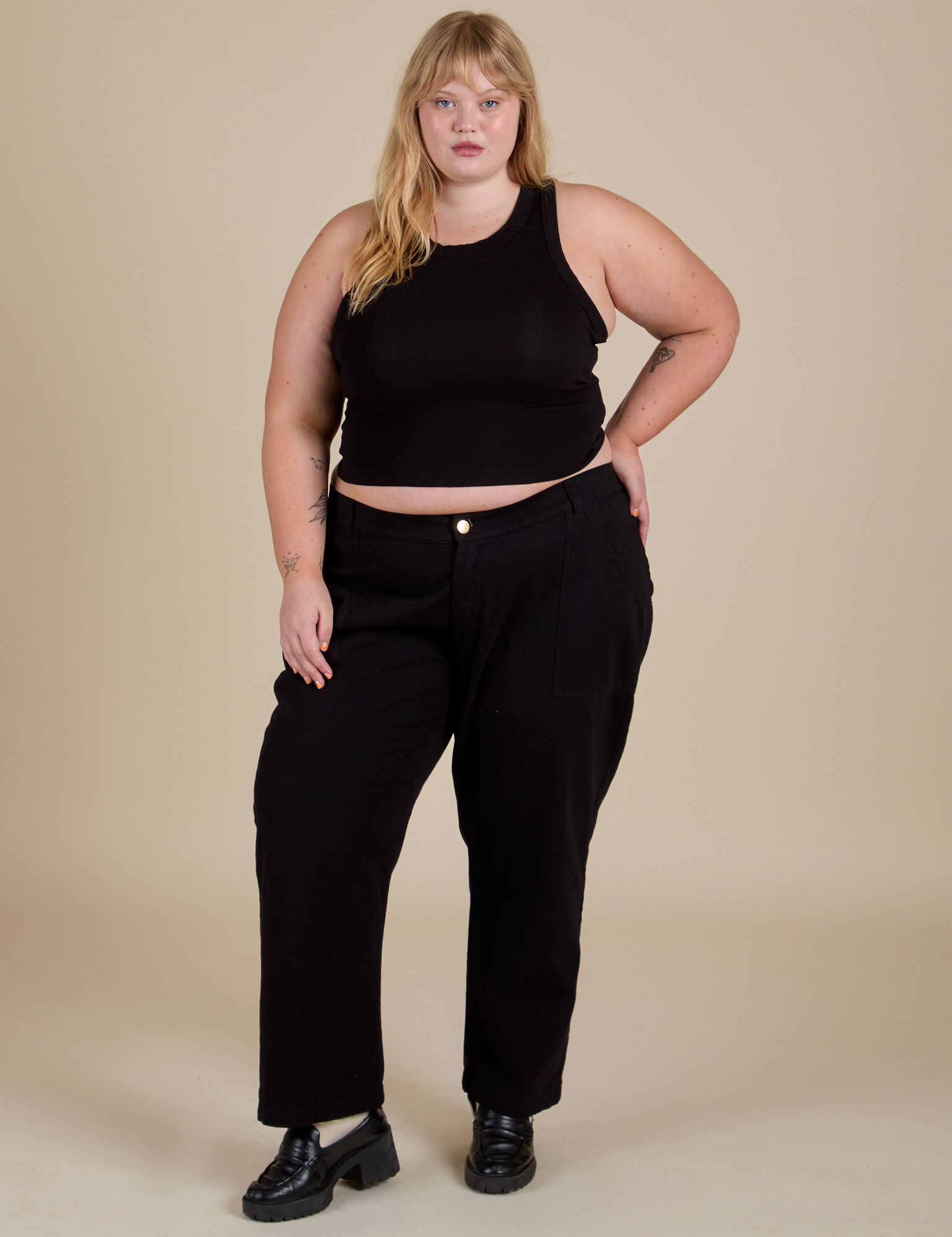Juliet is wearing Racerback Tank in Black and black Work Pants