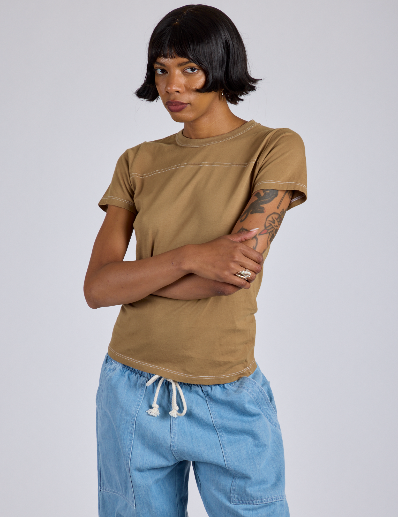Jr. Varsity Tee in Desert Brown angled front view on Kira