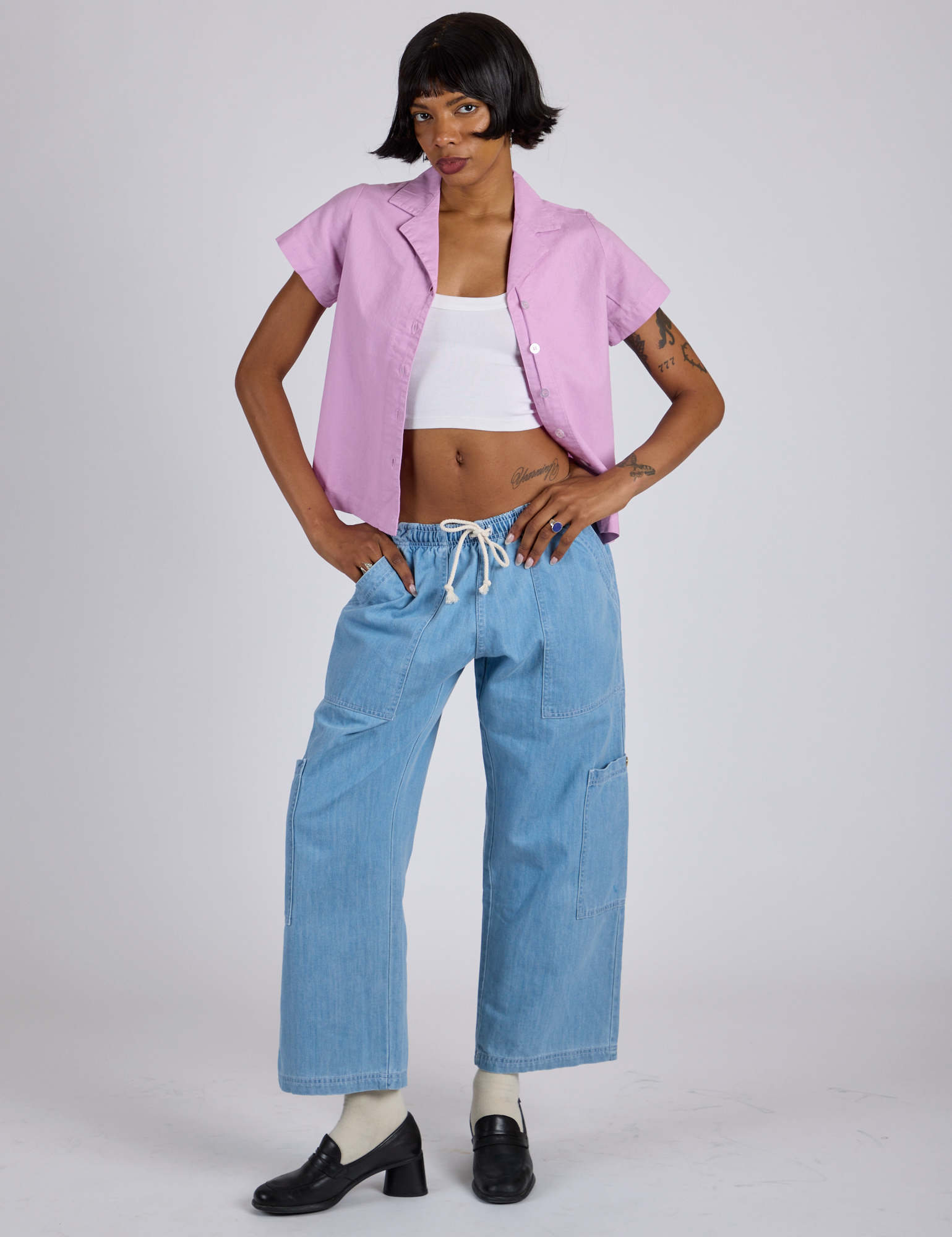 Kira is wearing Pantry Button-Up in Lilac Purple and light wash Denim Drop Pocket Pants