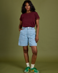 Kandia is wearing Vintage Ringer Tee in Red Wine tucked into light wash Carpenter Shorts 