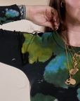 Front shoulder close up of Long Sleeve Baby Tee in Green Pool