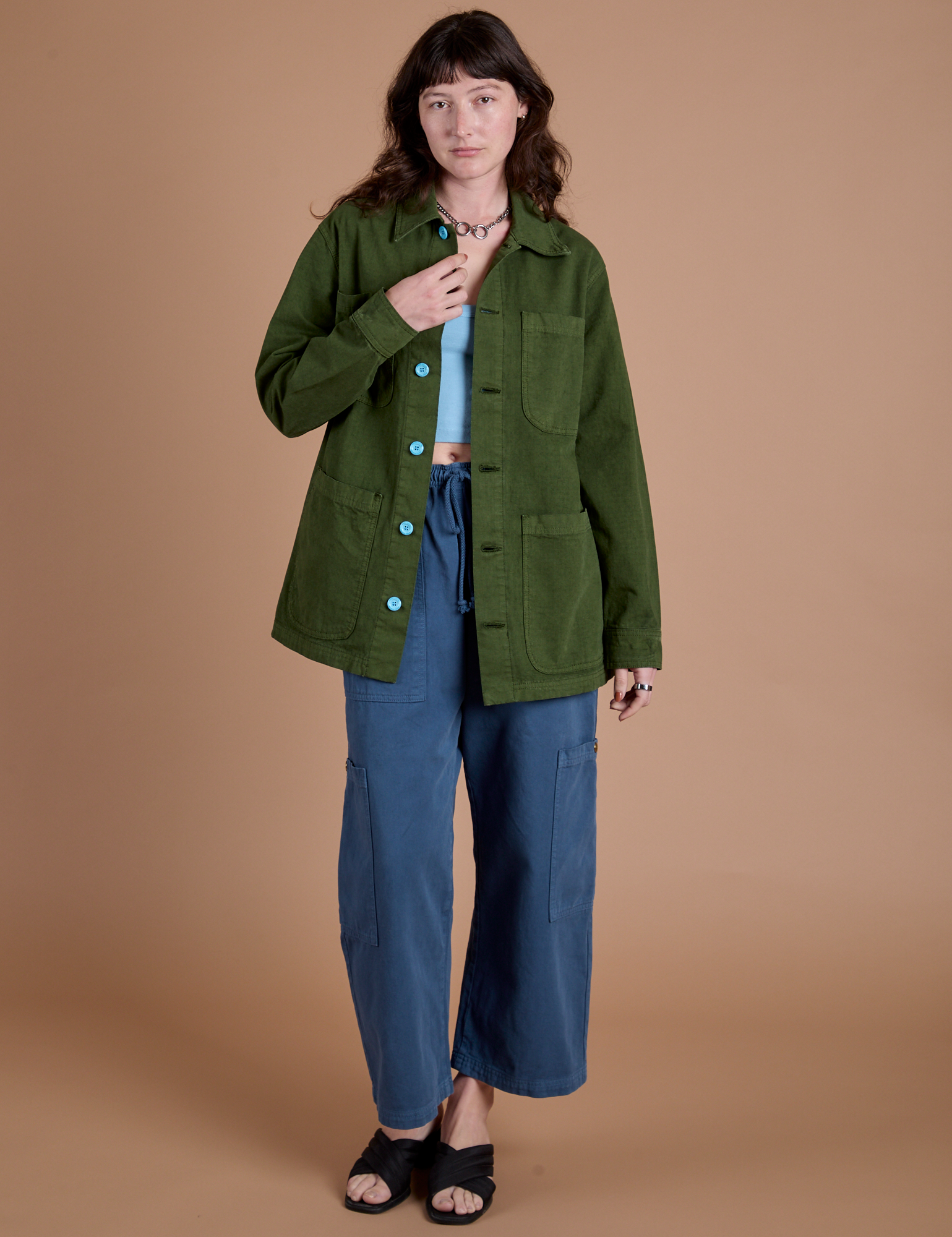 Alex is wearing Ripstop Field Coat in Evergreen paired with french blue Drop Pocket Cargo Pants