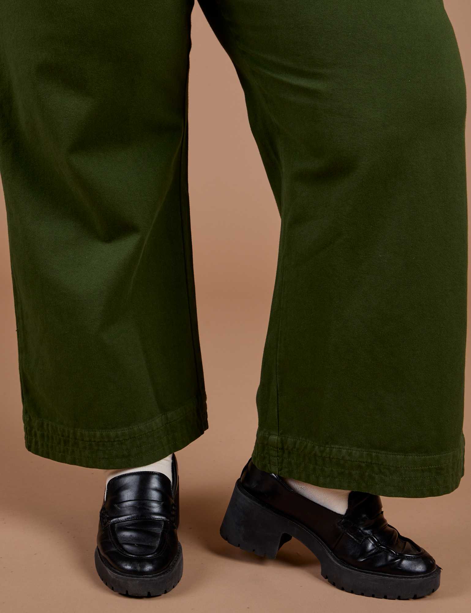 Organic Action Pants in Evergreen pant leg close up on Juliet
