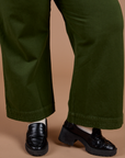 Organic Action Pants in Evergreen pant leg close up on Juliet