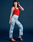 Side view of Work Pants in Sunny Cloud Airbrush and mustang red Tank Top on Alex