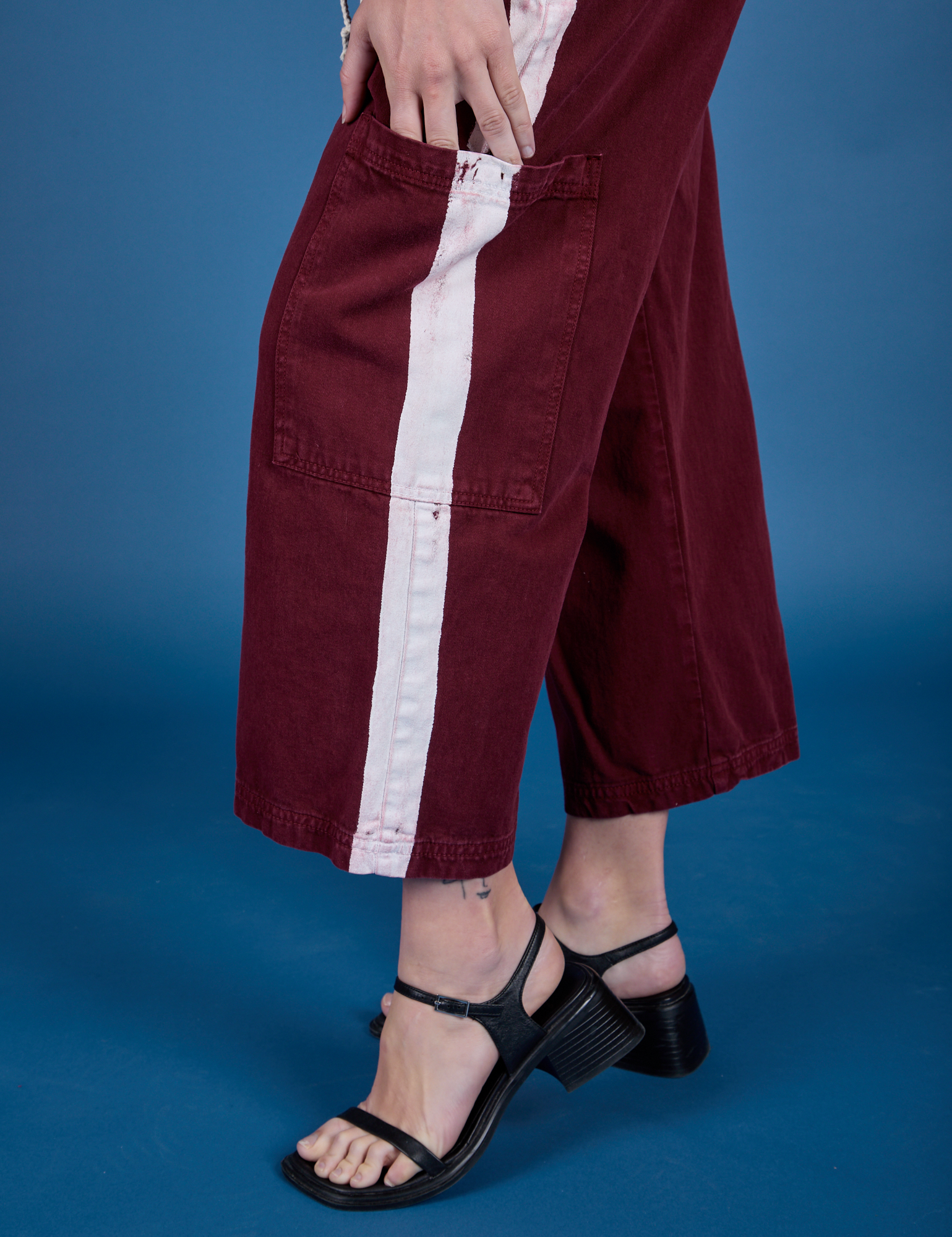 Painted Drop Pocket Cargo Pants in Red Wine close up of side pant leg pocket