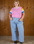 Juliet is wearing  Calypso Tee in Bubblegum Multi tucked into light wash Denim Wide Leg Trousers