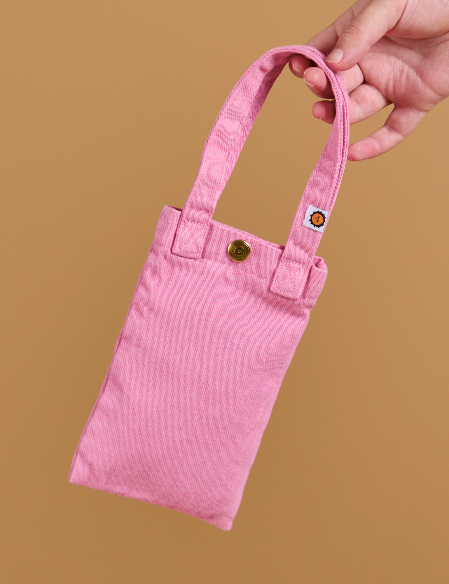 Cell Phone Tote in Bubblegum Tote held by model