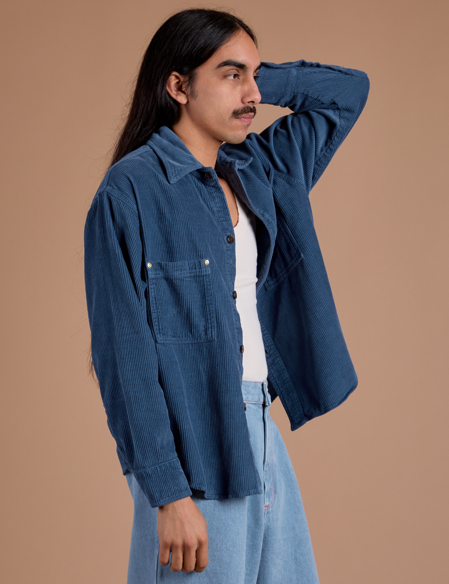 Angled front view of Cropped Corduroy Overshirt in French Blue on Anthony