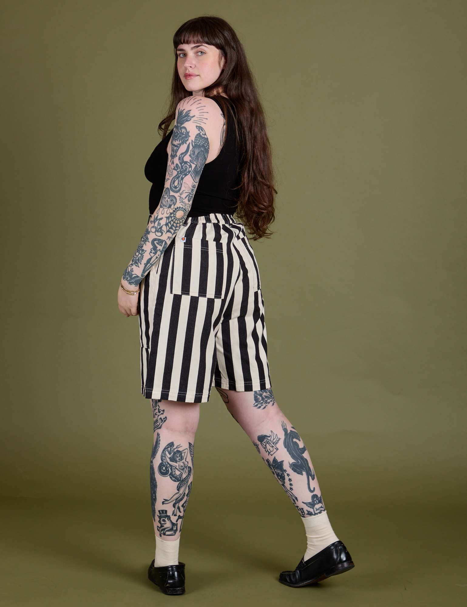 Longline Work Shorts in Natural angled back view on Sydney
