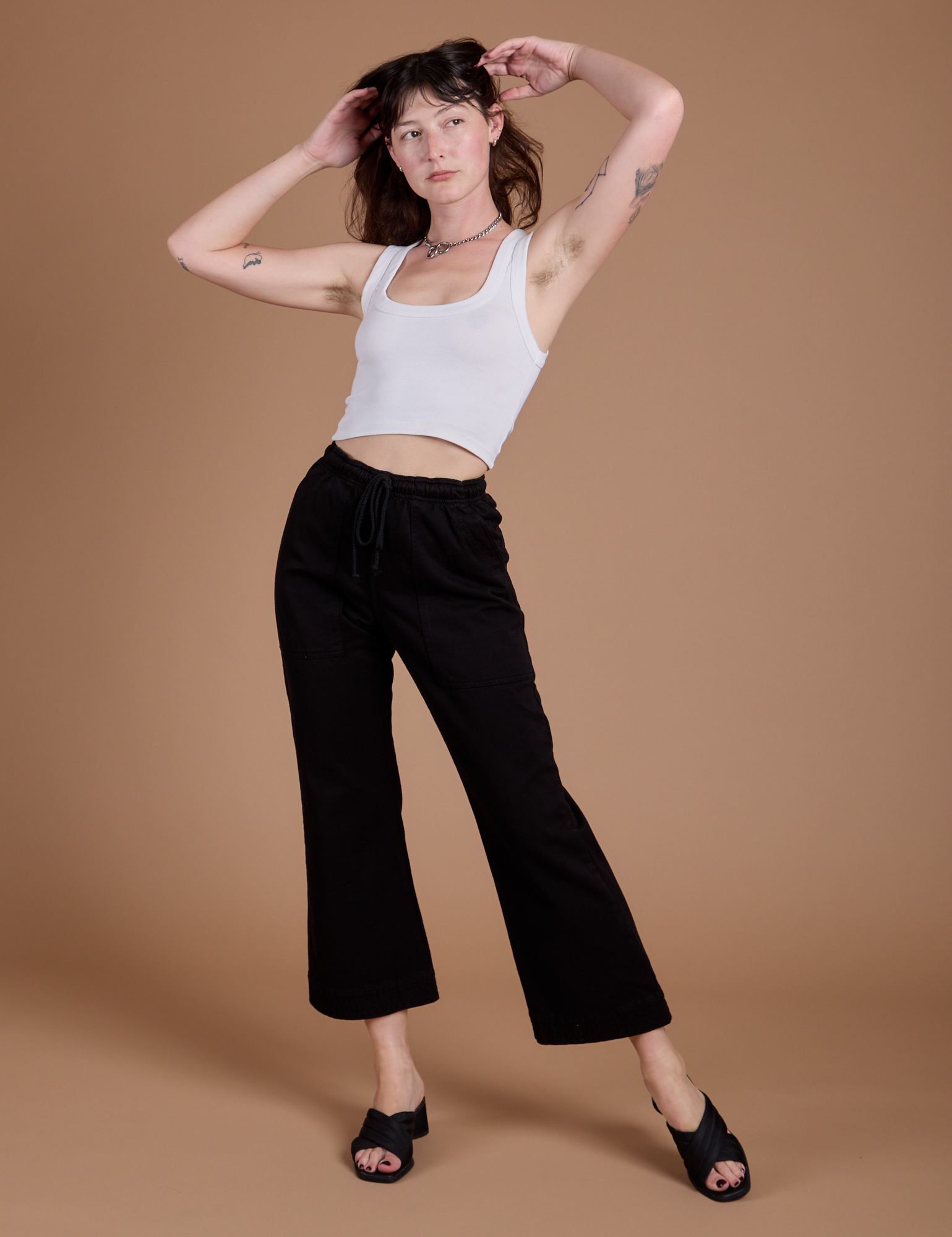 Organic Action Pants in Basic Black and vintage tee white Cropped Tank on Alex