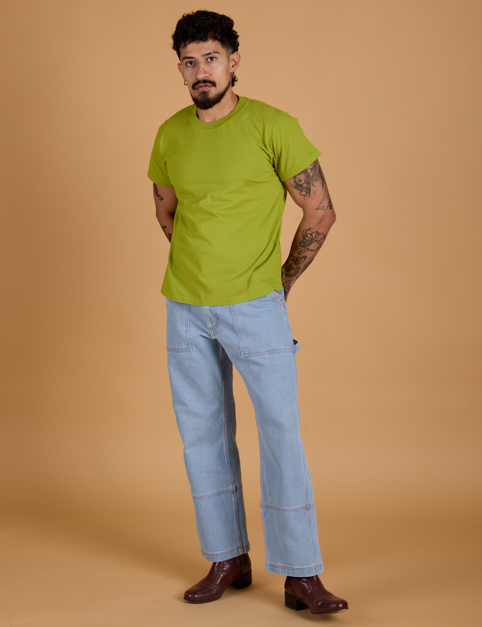 Organic Vintage Tee in Gross Green and light wash Carpenter Jeans on Jesse