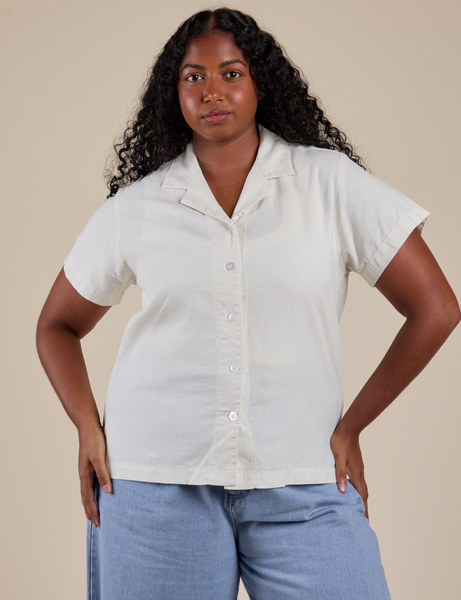 Meghna is wearing a buttoned up Pantry Button-Up in Vintage Tee White