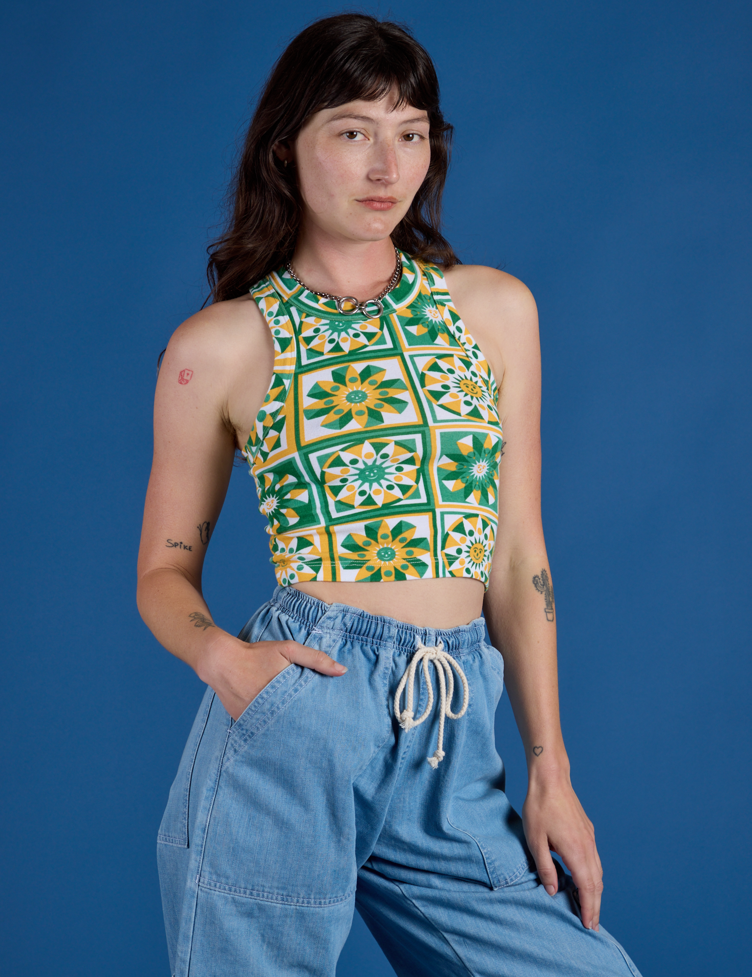 Deep-Cut Racerback Tank in Spring Quilt Print angled front view on Alex