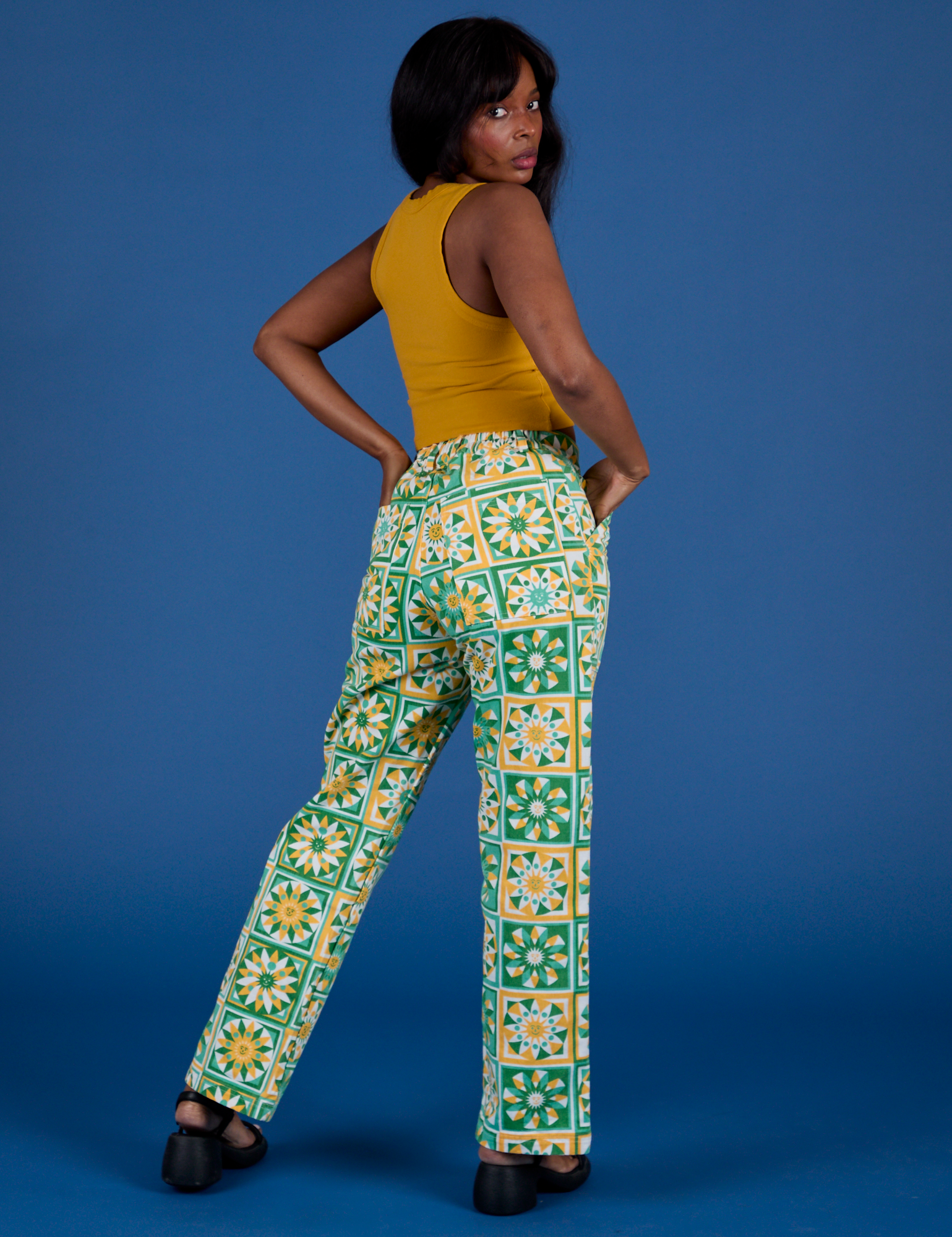 Back view of Work Pants in Spring Quilt Print and mustard yellow Cropped Tank
