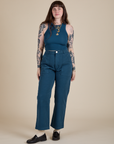 Sydney is wearing Racerback Tank in Lagoon paired with lagoon Work Pants