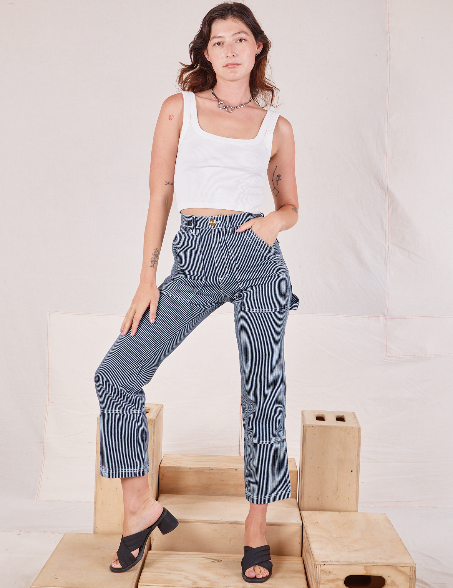 Alex is wearing Carpenter Jeans in Indigo Railroad and vintage tee off-white Square Neck Tank