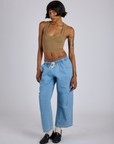 Cropped Tank Top in Desert Brown and light wash Denim Drop Pocket Pants on Kira