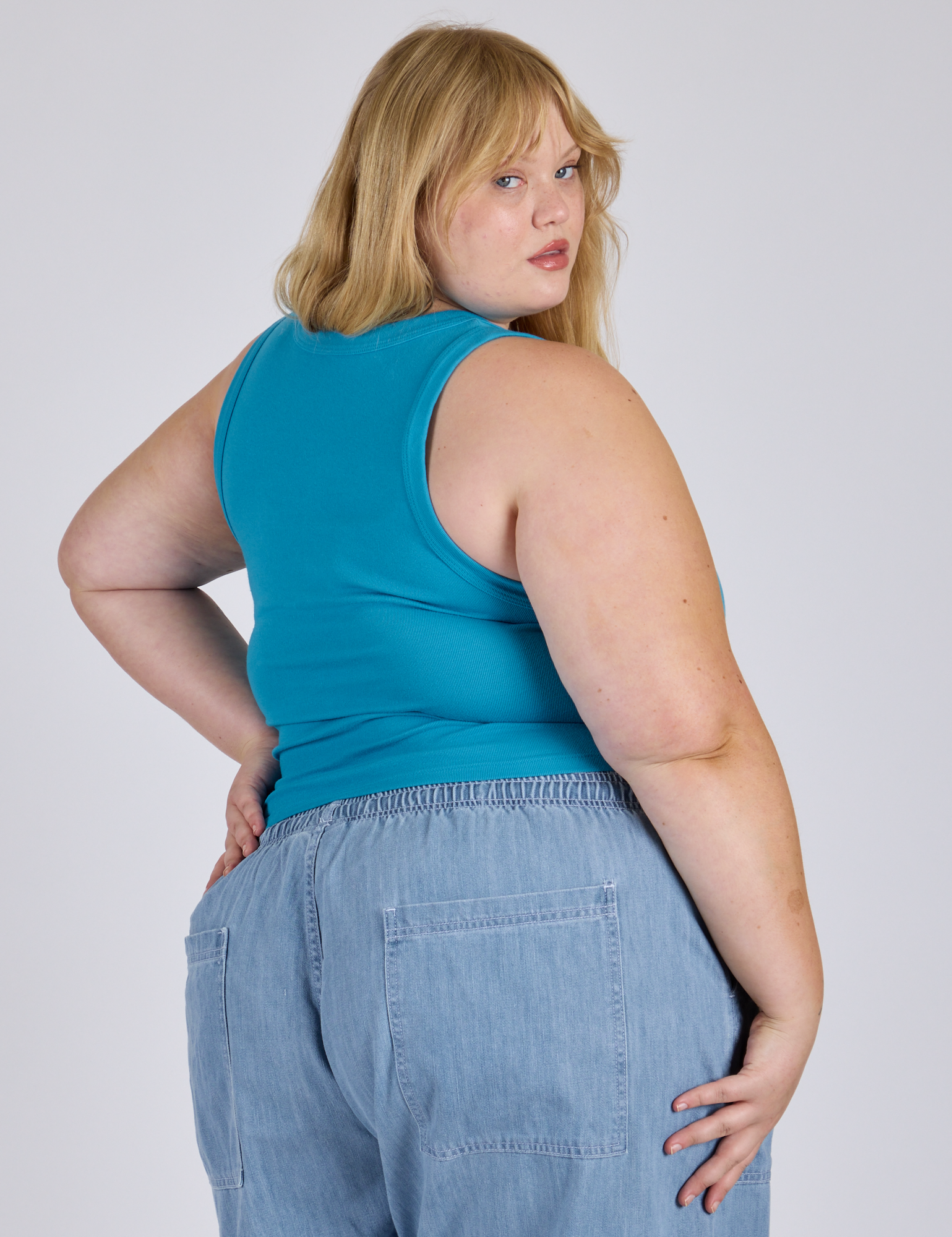 Angled back view of Cropped Tank Top in Hawaiian Blue on Juliet