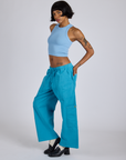 Side view of Drop Pocket Cargo Pants in Hawaiian Blue and baby blue Racerback Tank