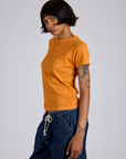 Jr. Varsity Tee in Creamsicle Orange side view on Kira