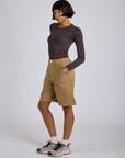 Side view of Longline Work Shorts in Desert Brown and espresso brown Long Sleeve Baby Tee on Kira