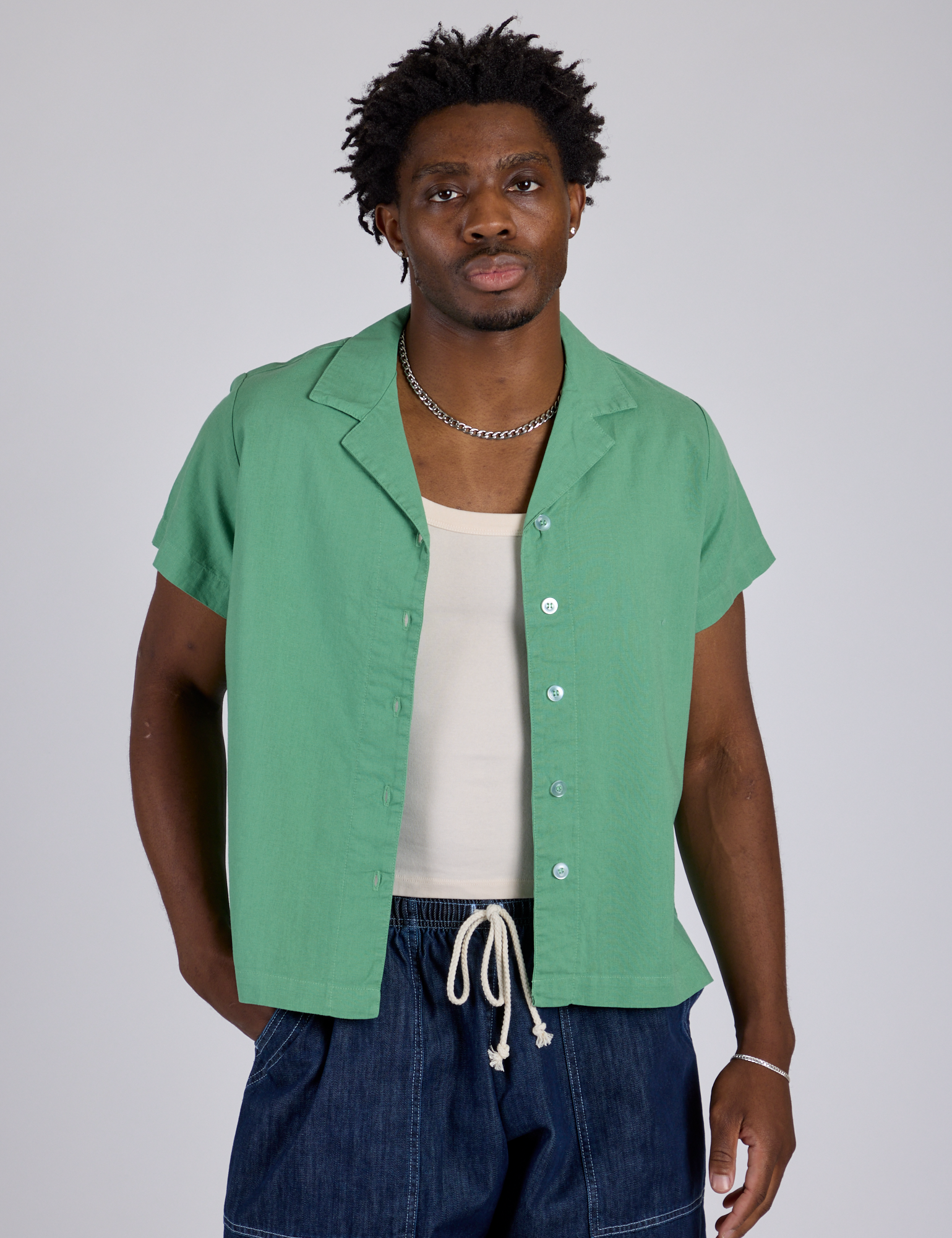 Isaac is wearing Pantry Button-Up in Seafoam Green