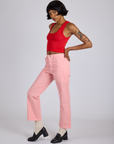 Side view of Work Pants in Baby Pink and mustang red Cropped Tank on Kira