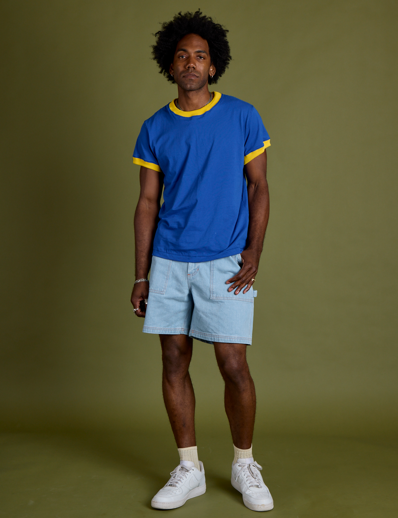 Jerrod is wearing Vintage Ringer Tee in Royal Blue and light wash Carpenter Shorts