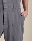 Close up of Quinn's hand in the front pocket of Short Sleeve Jumpsuit in Washed Grey