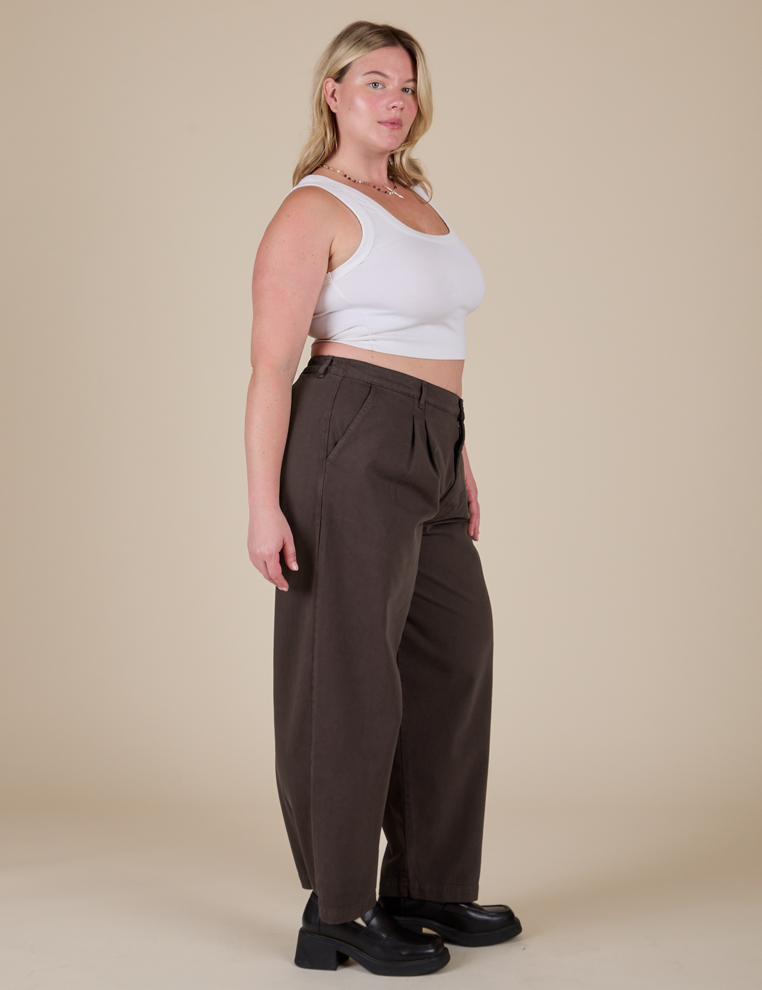 Side view of Heavyweight Trousers in Espresso Brown and vintage tee white Cropped Tank