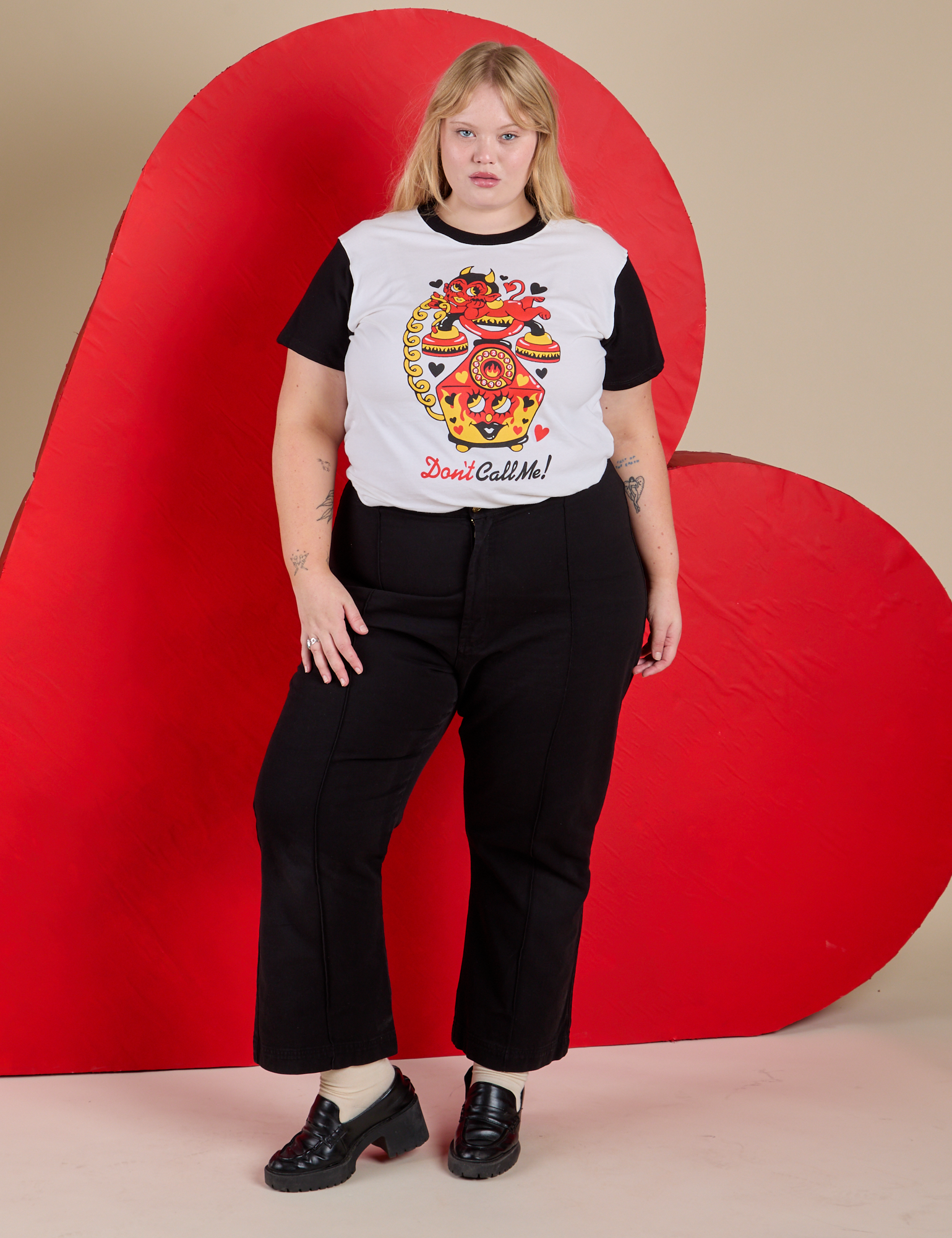 Juliet is wearing Vintage Tee in Don't Call Me paired with black Western Pants