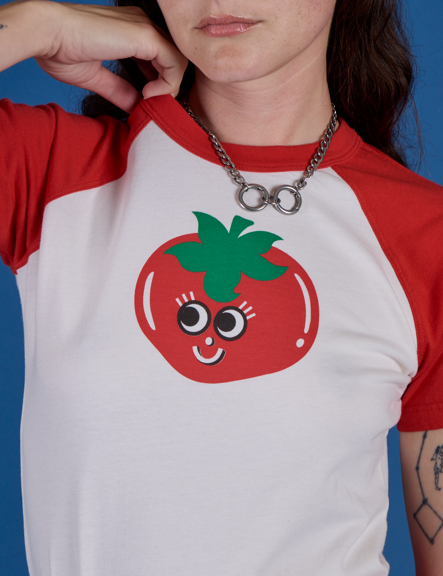 Front close up of Produce Raglan Tee in Tomato on Alex