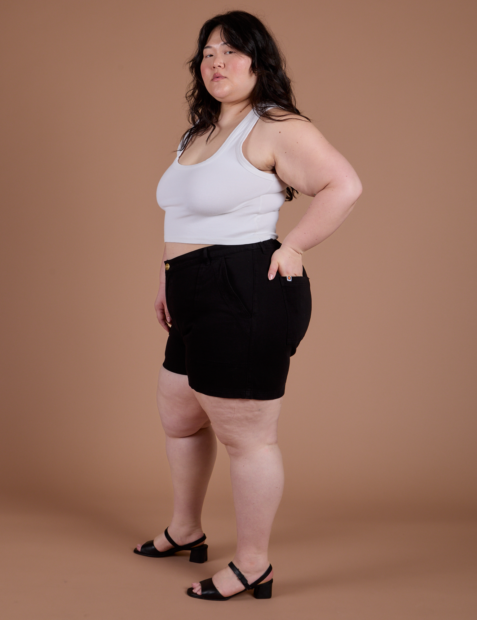 Side view of Classic Work Shorts in Basic Black and Cropped Tank in Vintage Tee White on Ashley