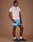 Angled view of Classic Work Shorts in Baby Blue and vintage off white Organic Vintage Tee on Jerrod