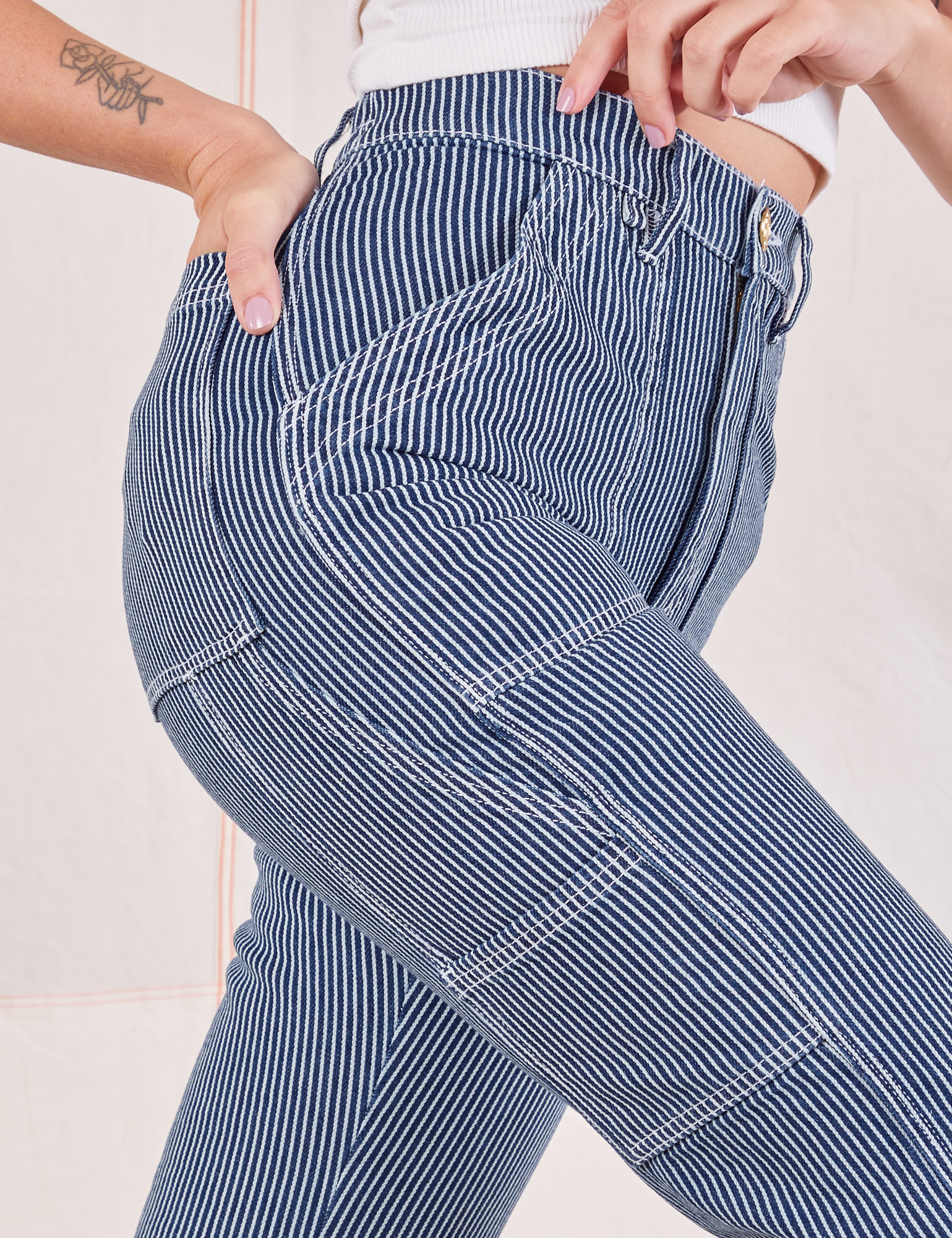 Carpenter Jeans in Indigo Railroad side close up on Alex