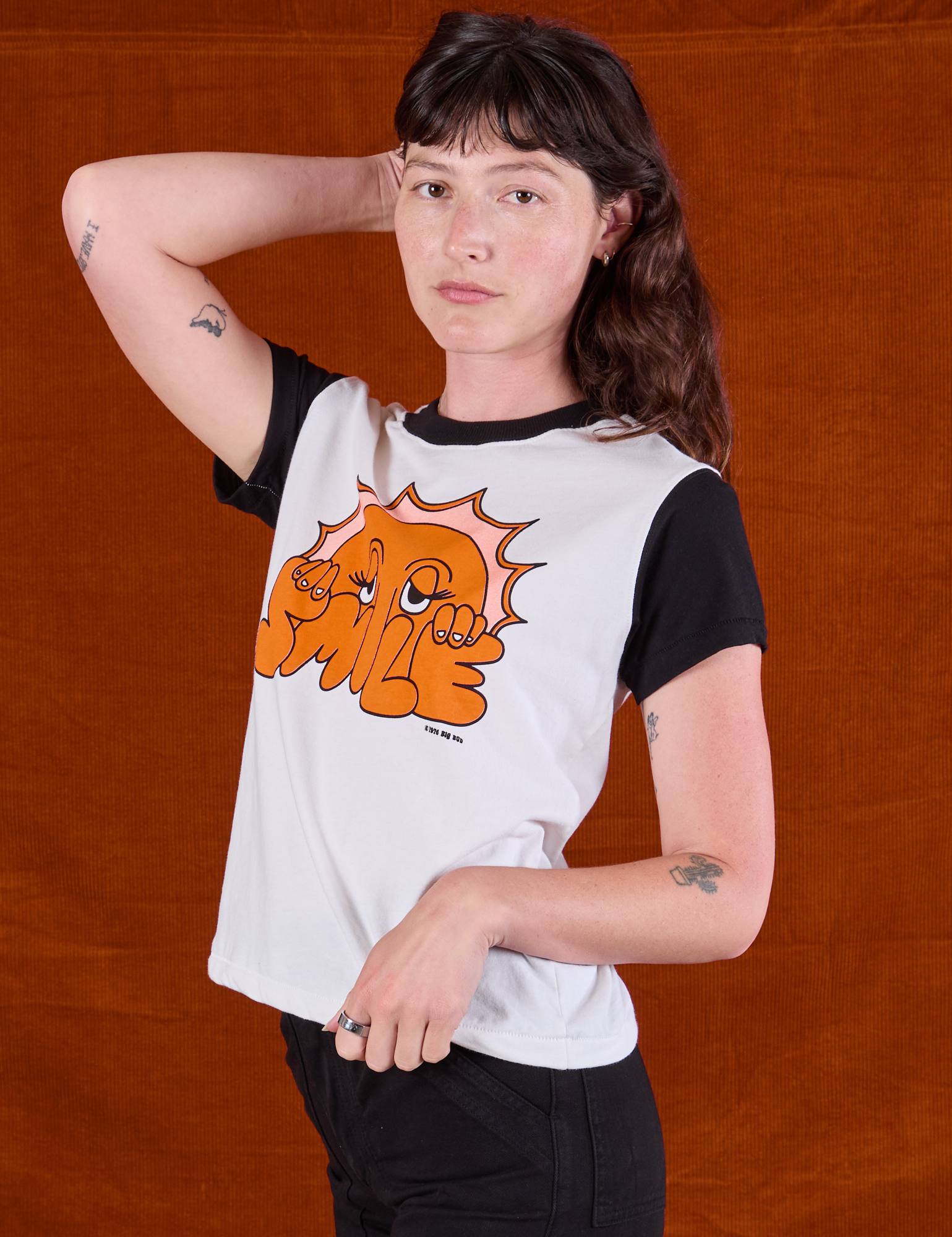 Anniversary Tee in Smile angled front view on Alex