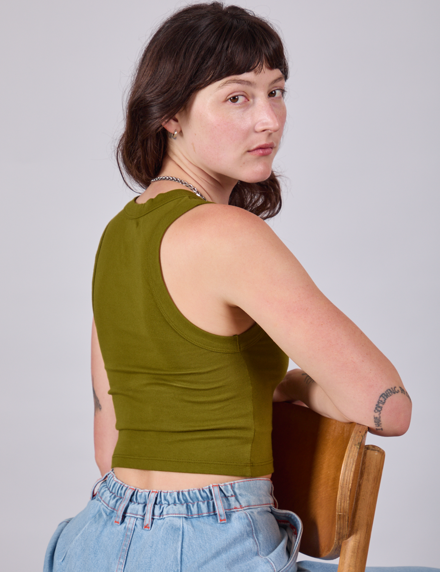 Cropped Tank Top in Olive Green angled back view on Alex