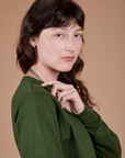Long Sleeve Burly Tee in Evergreen side shoudler close up on Alex