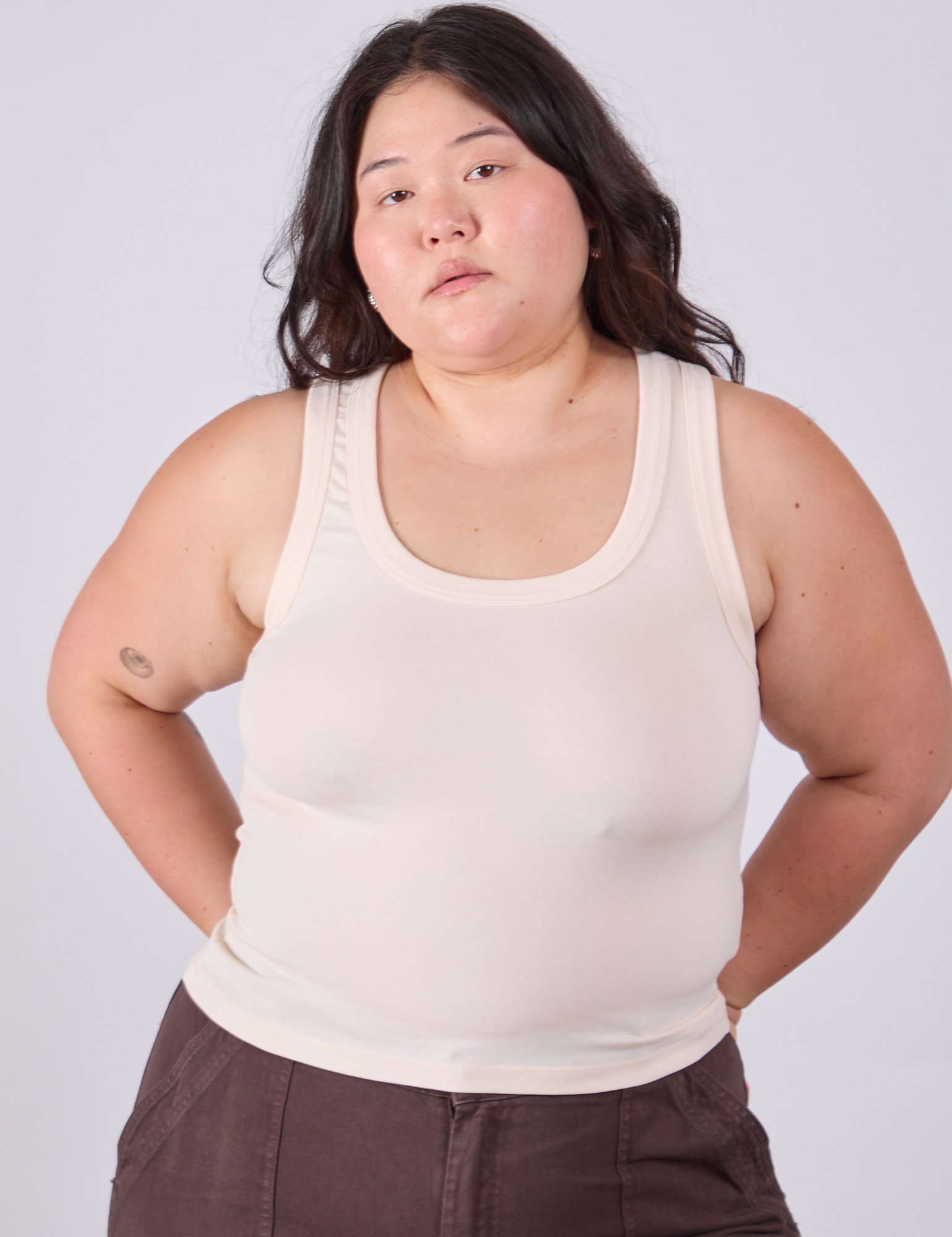 Ashley is 5'7" and wearing L Tank Top in Vintage Tee Off-White