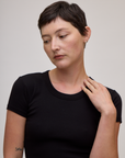 Front close up of Baby Tee in Basic Black on Alex