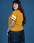 Painted Burly Tee in Mustard Yellow angled back view on Sydney