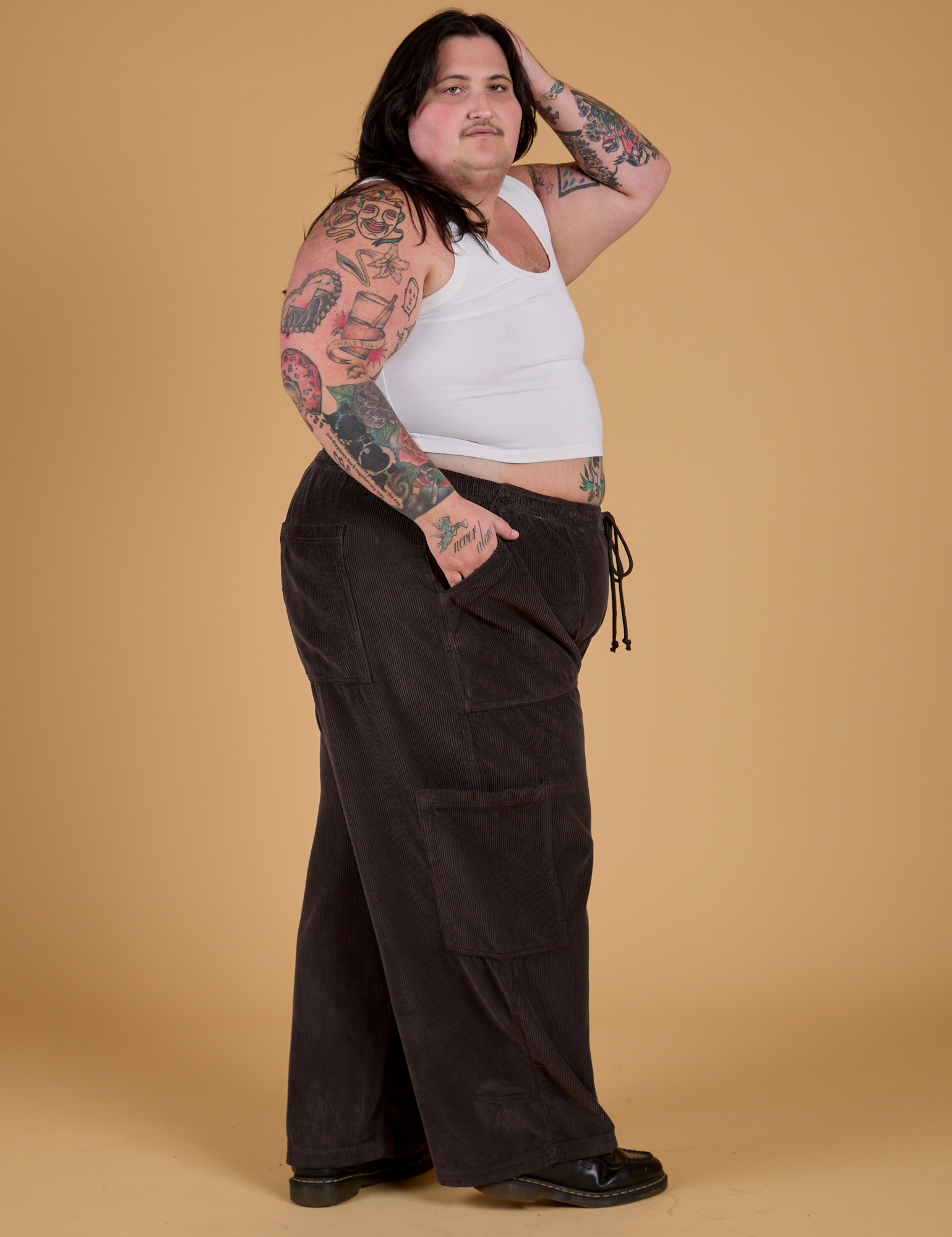 Side view of Corduroy Drop Pocket Cargo Pants in Espresso Brown and Cropped Tank in Vintage Tee White on Sam