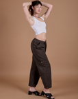 Side view of Drop Pocket Cargo Pants in Espresso Brown and Cropped Tank in Vintage Tee White on Alex