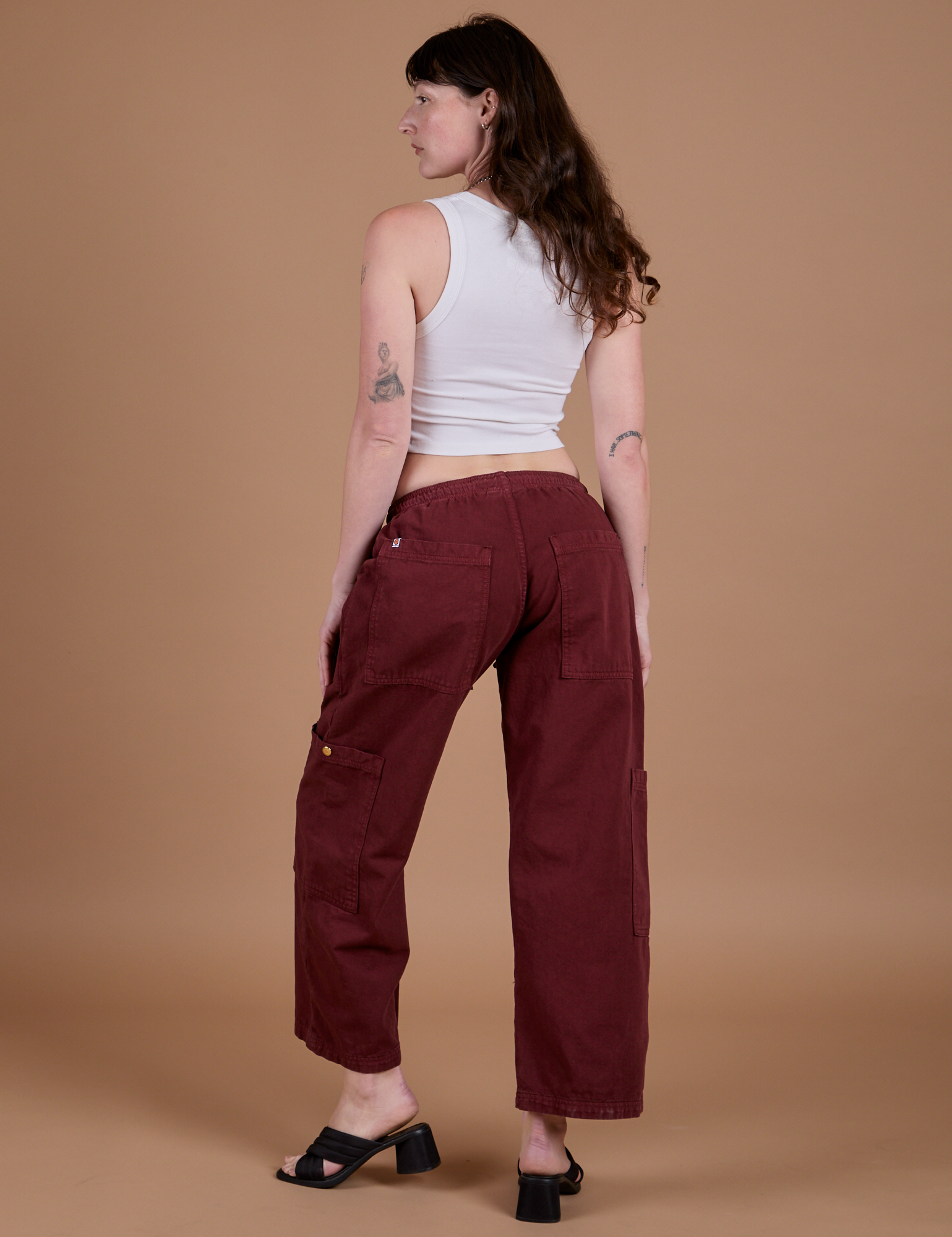 Angled back view of Drop Pocket Cargo Pants in Red Wine on Alex