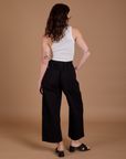 Drop Pocket Cargo Pants in Basic Black back view on Alex