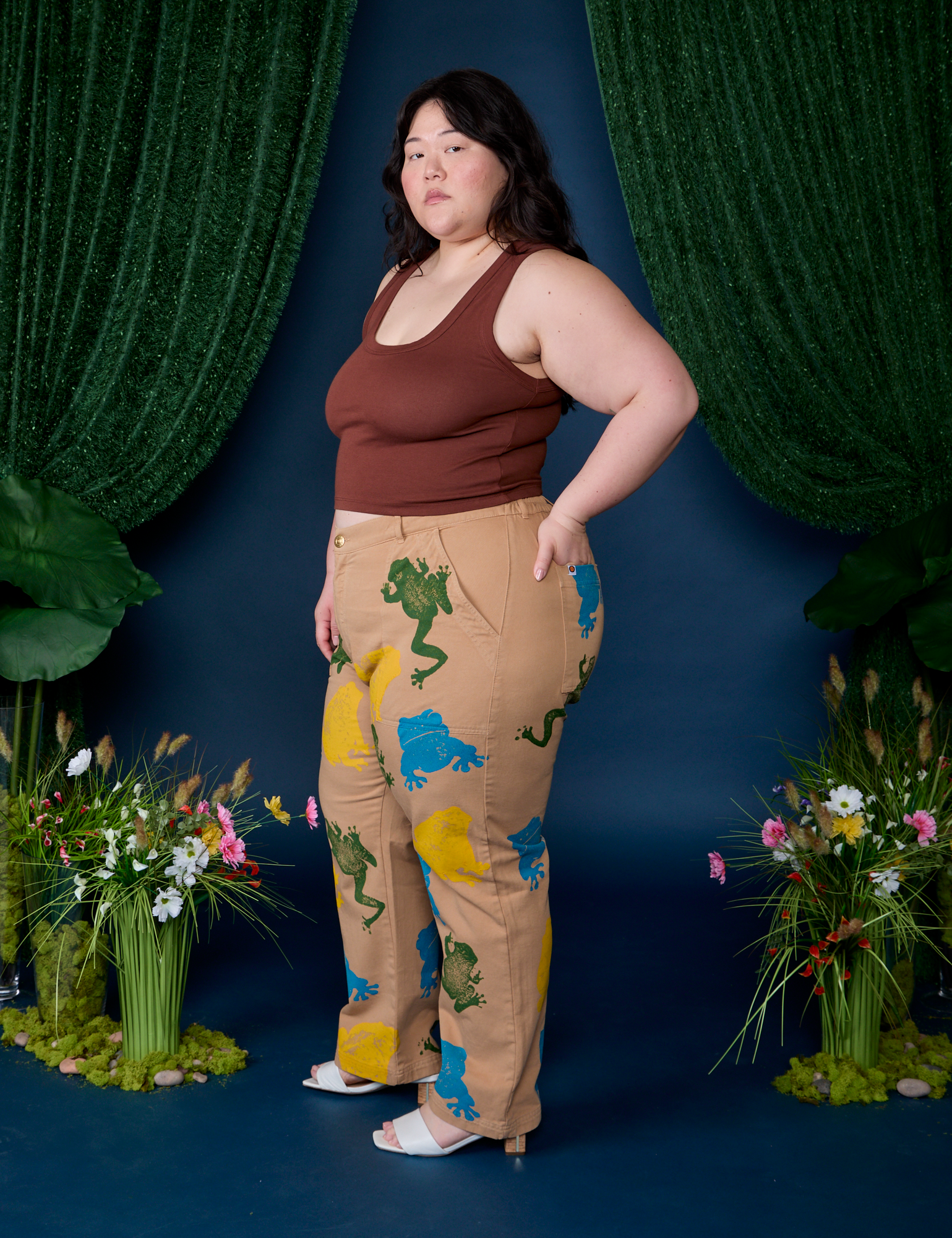 Side view of Paintstamped Work Pants in Froggy and fudgesicle brown Cropped Tank on Ashley
